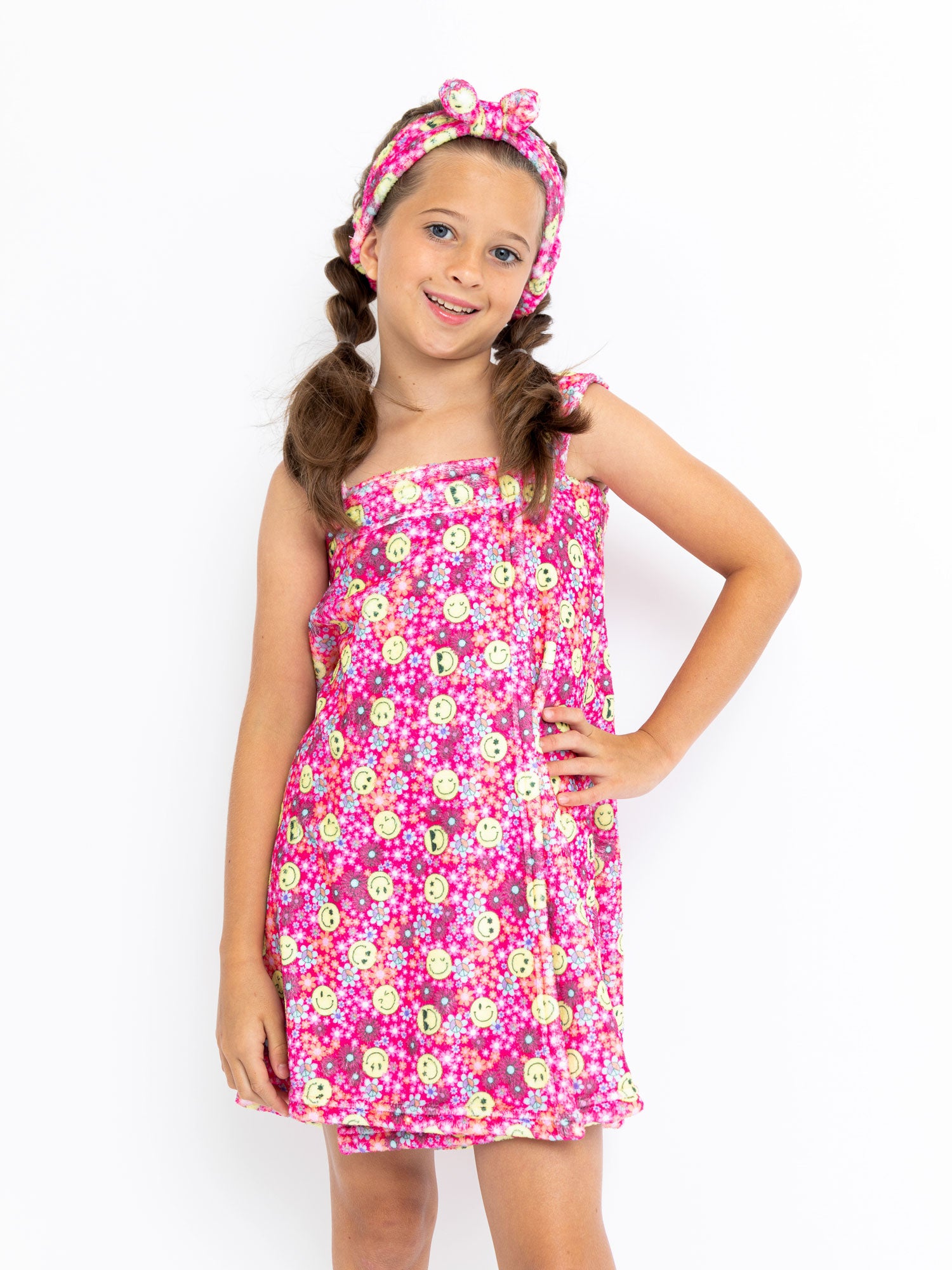 girls spa towel wrap with removable straps in a pink floral print with smiley faces